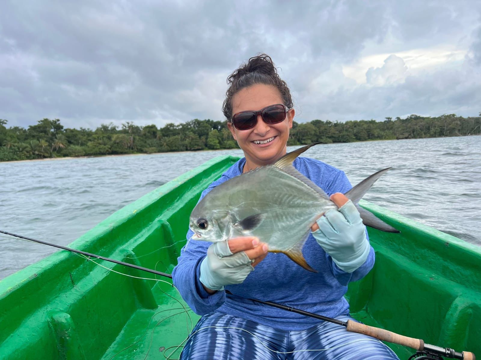 Guest holding a fresh catch during a Caribbean fishing experience